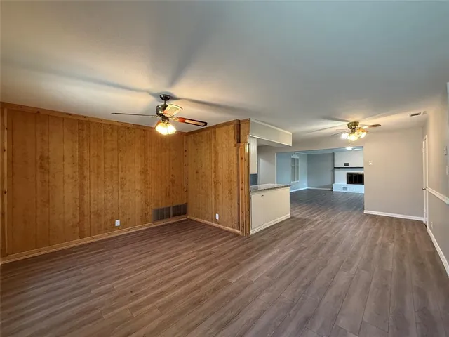 a view of a livingroom with a furniture wooden floor and window