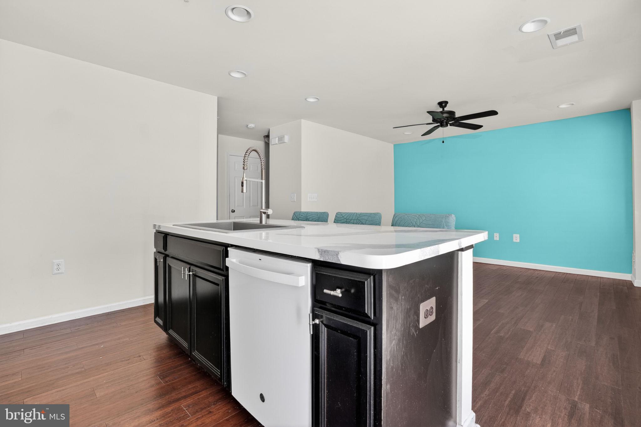 158 Intrepid Lane, Unit 92 Berlin, MD 21811 - Photo 13 of 37 a kitchen with a sink and a refrigerator