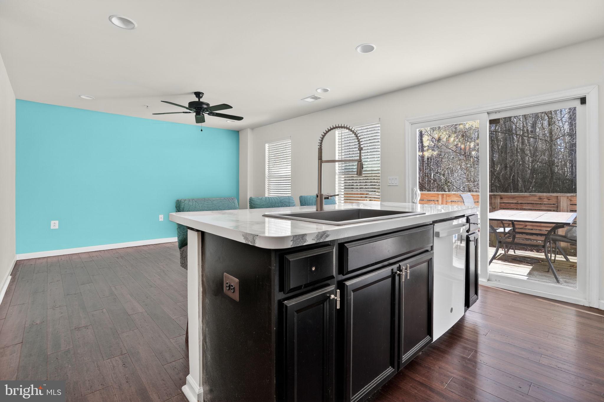 158 Intrepid Lane, Unit 92 Berlin, MD 21811 - Photo 15 of 37 a kitchen with a sink and a refrigerator