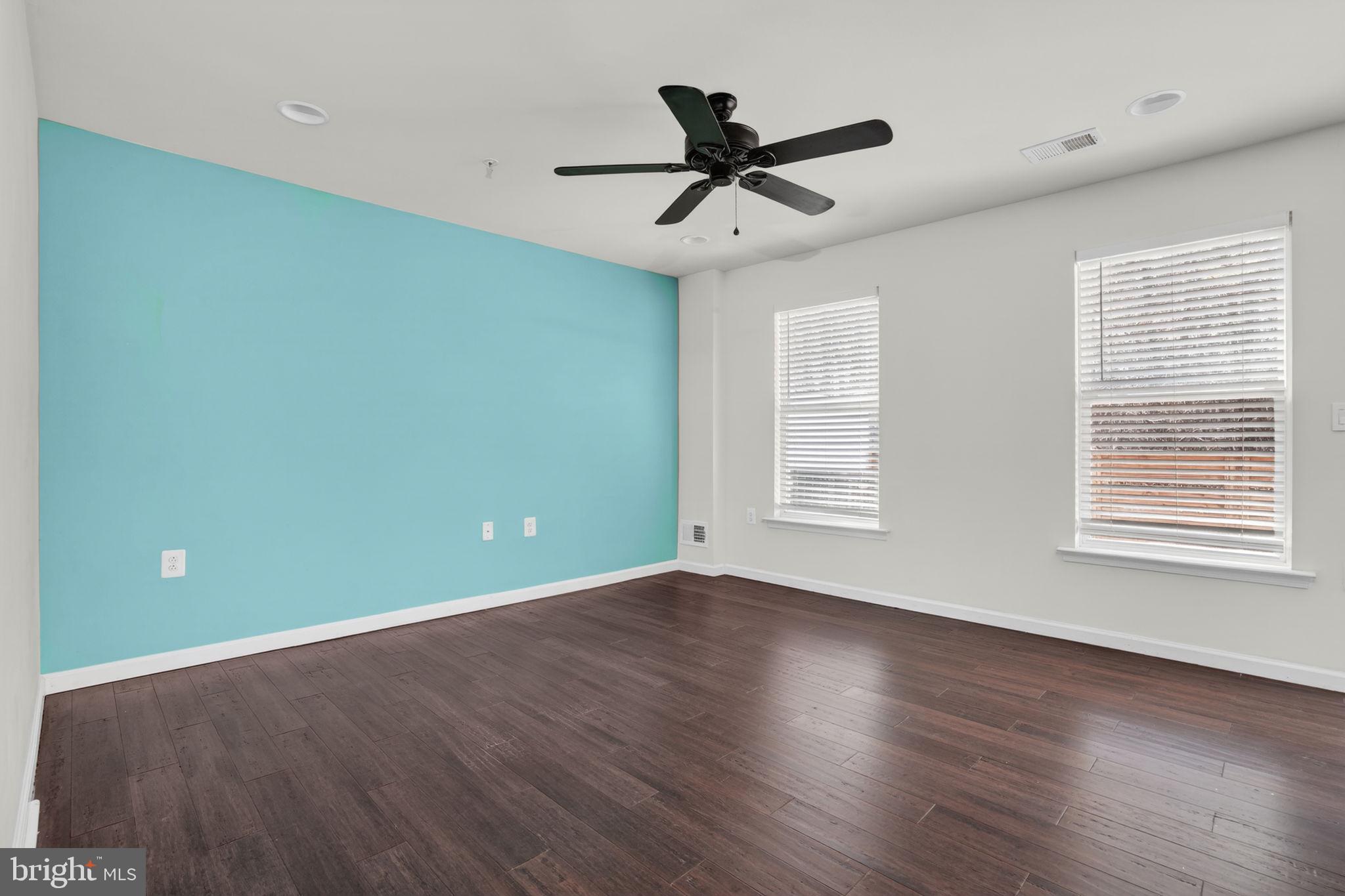 158 Intrepid Lane, Unit 92 Berlin, MD 21811 - Photo 16 of 37 a view of a big room with wooden floor and windows