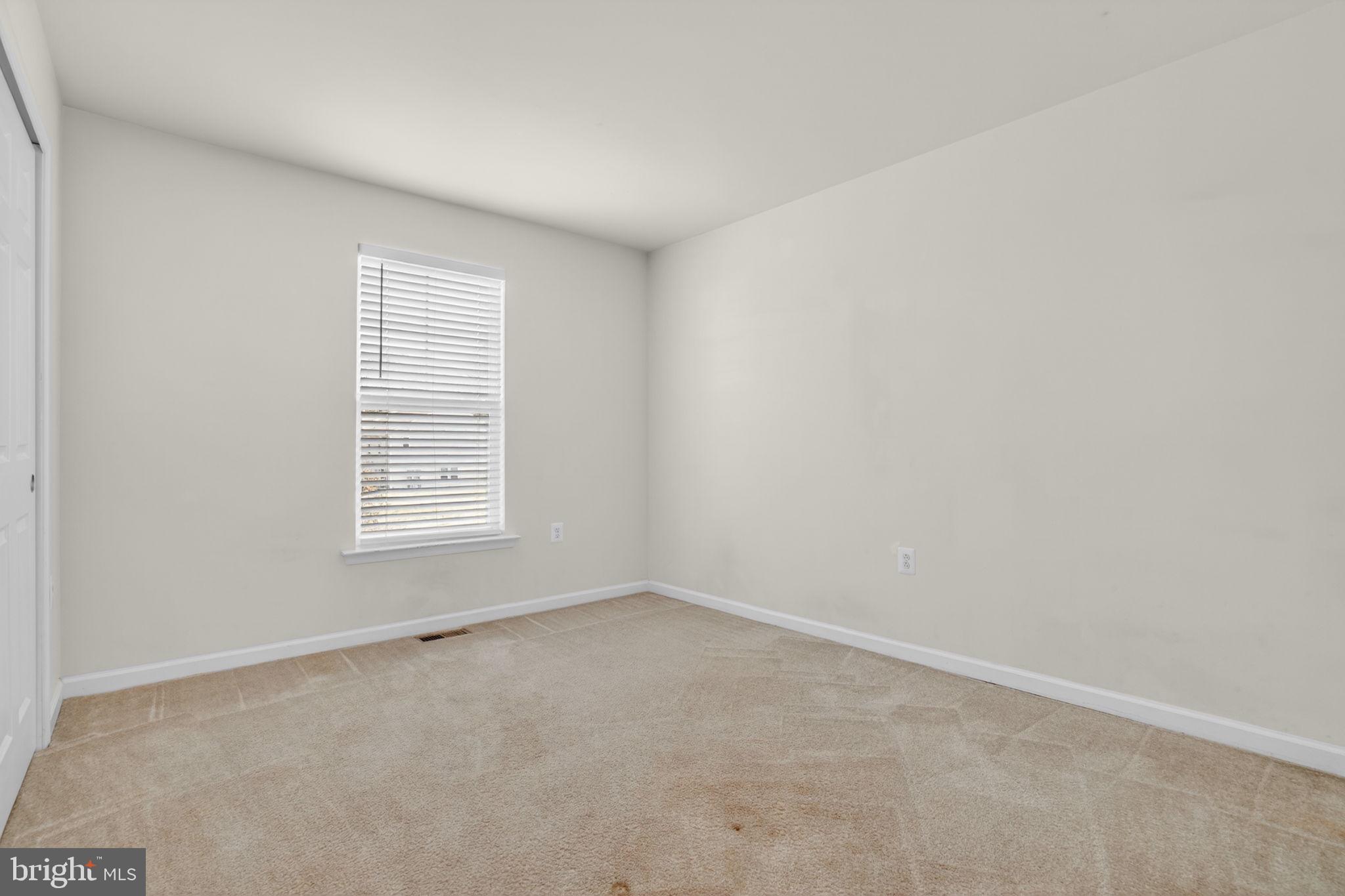 158 Intrepid Lane, Unit 92 Berlin, MD 21811 - Photo 26 of 37 an empty room with a window