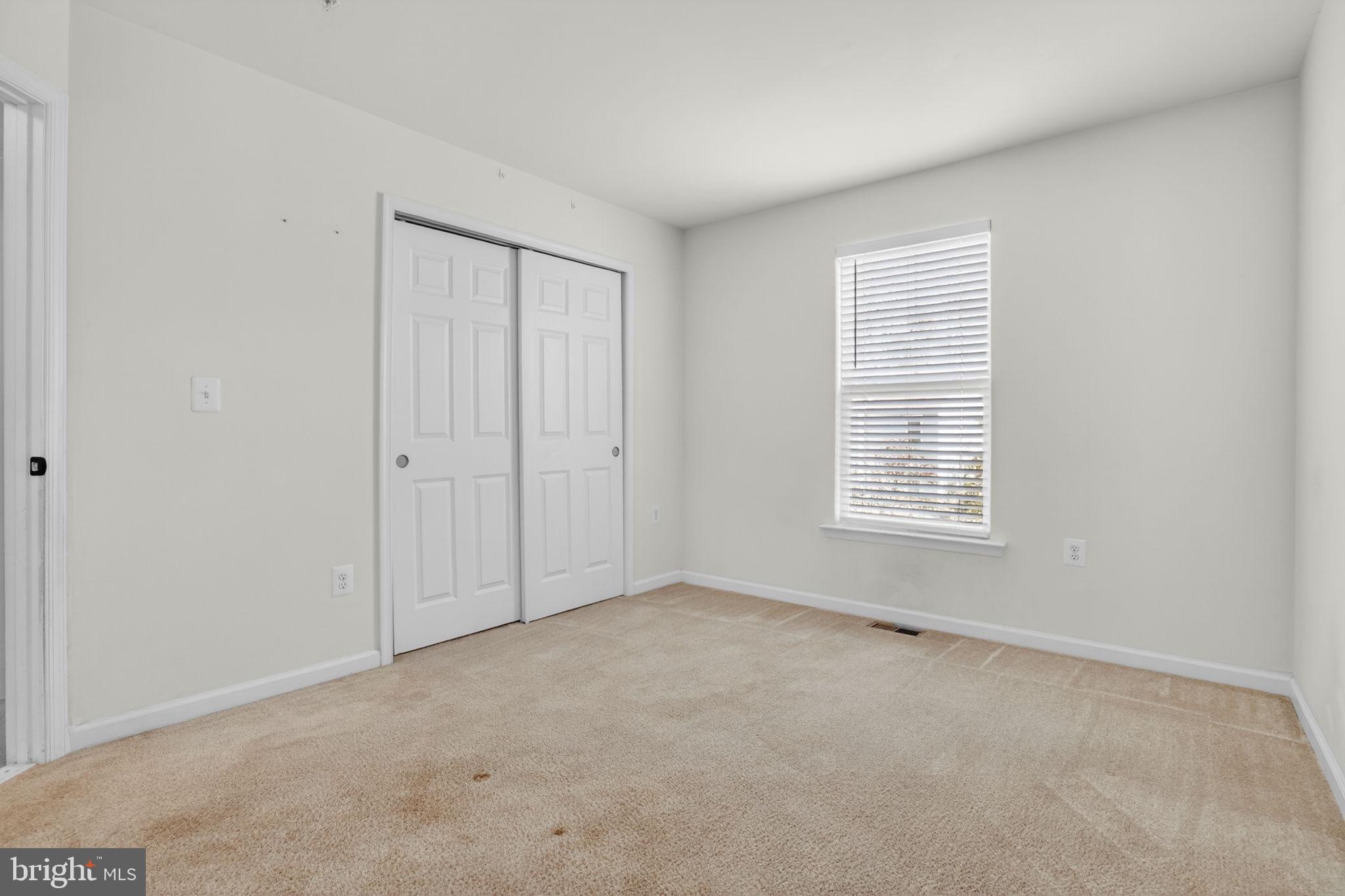 158 Intrepid Lane, Unit 92 Berlin, MD 21811 - Photo 27 of 37 an empty room with windows