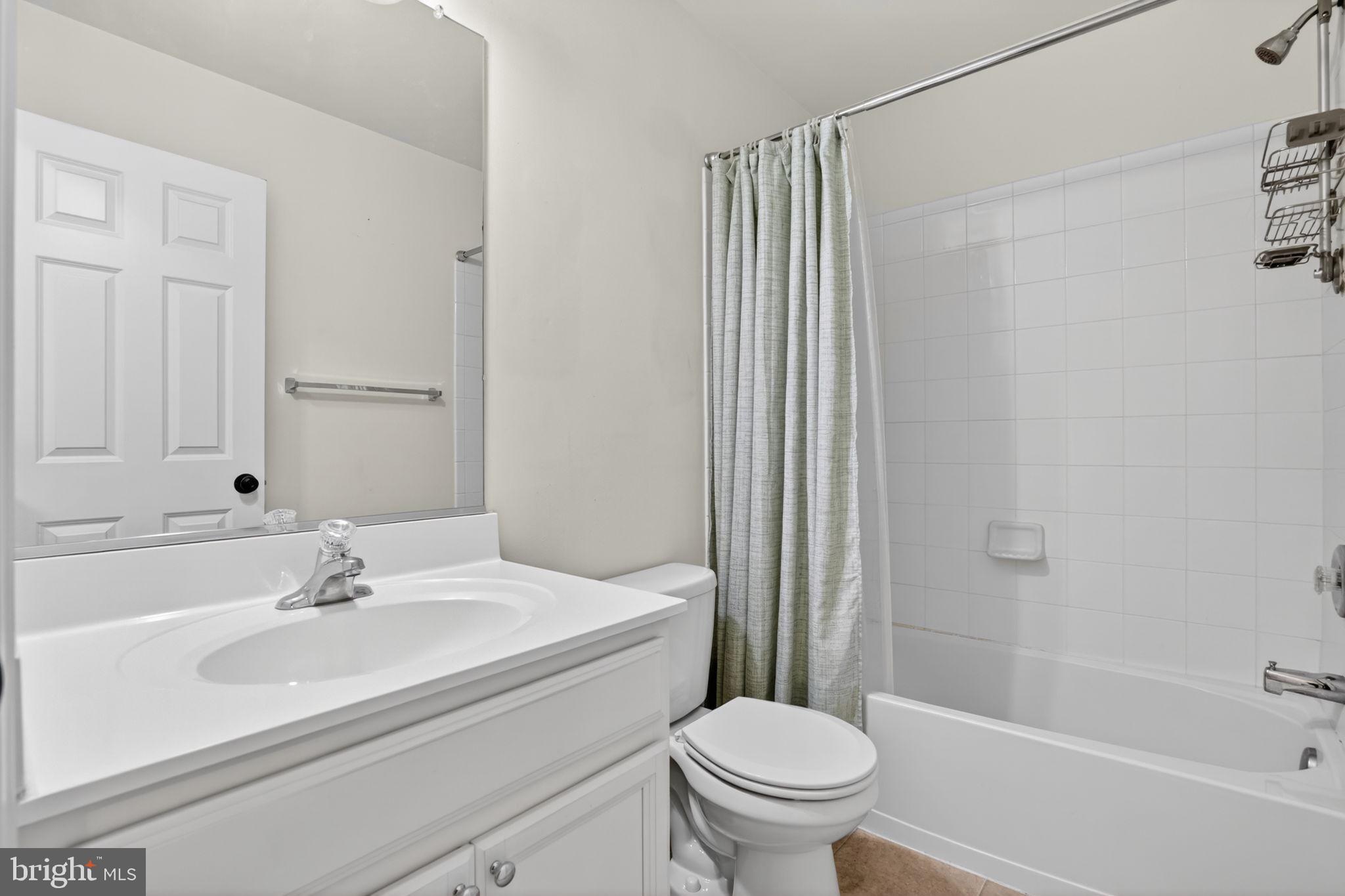 158 Intrepid Lane, Unit 92 Berlin, MD 21811 - Photo 29 of 37 a bathroom with a sink toilet and shower
