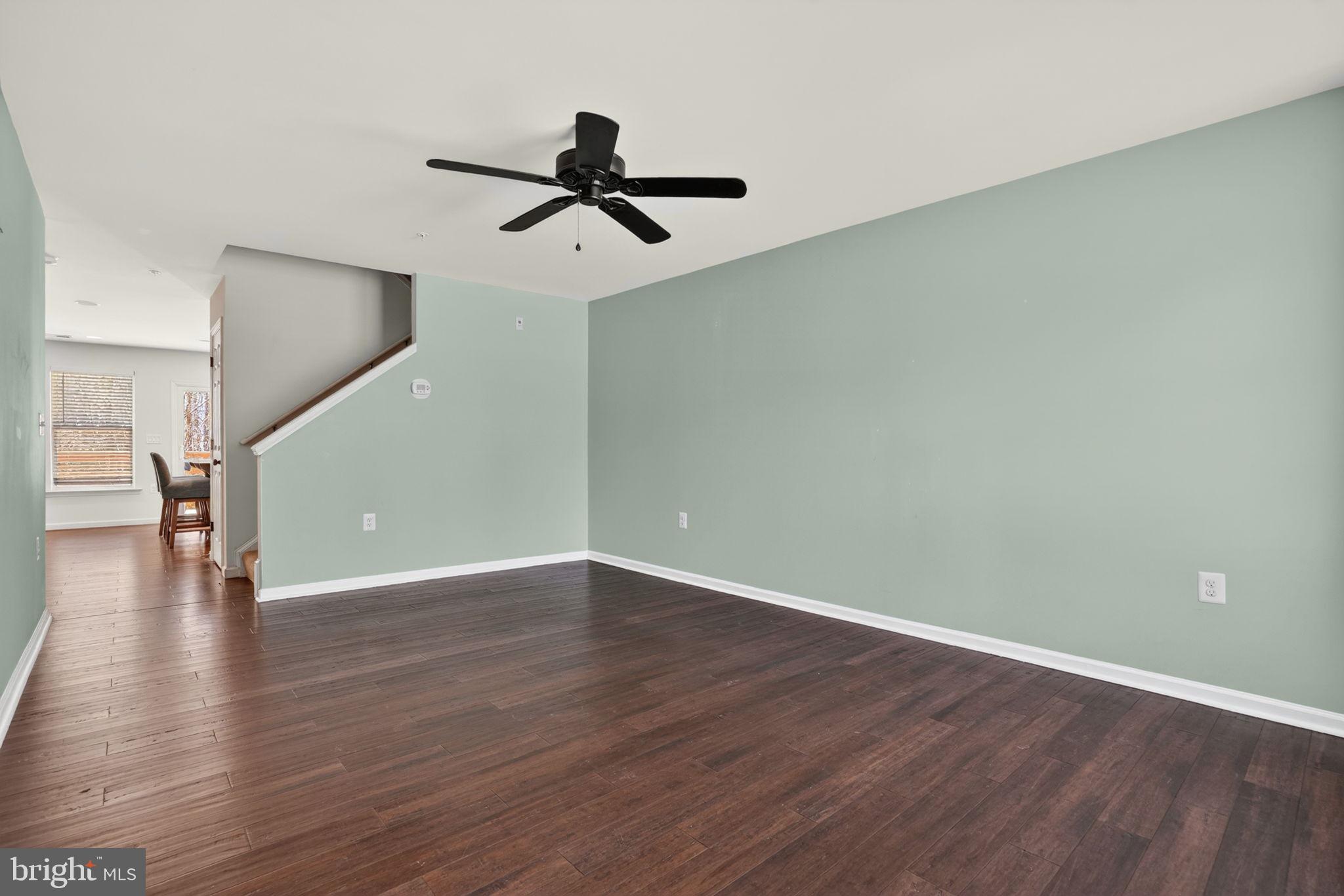 158 Intrepid Lane, Unit 92 Berlin, MD 21811 - Photo 3 of 37 a view of a room with wooden floor and staircase