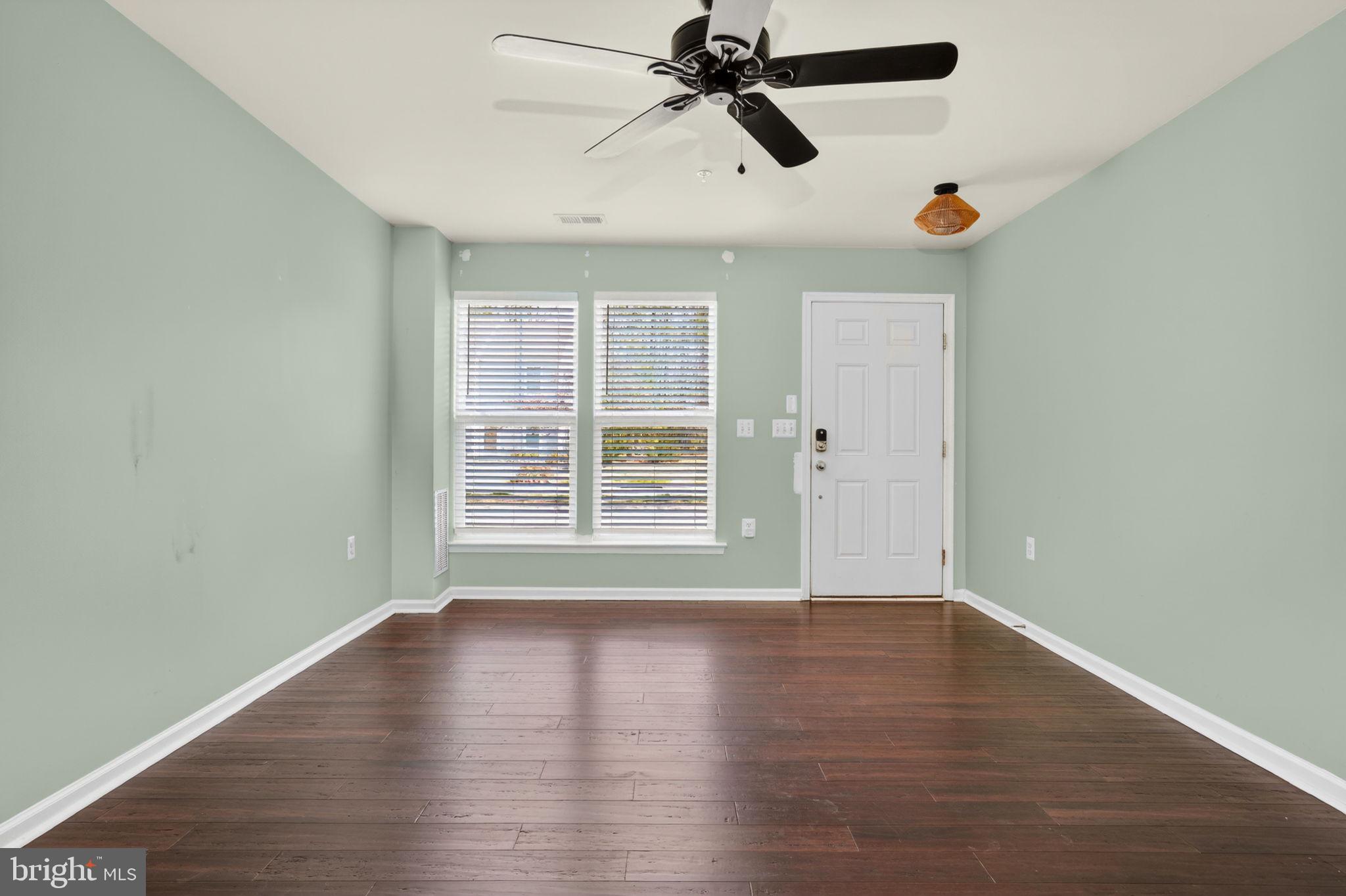 158 Intrepid Lane, Unit 92 Berlin, MD 21811 - Photo 6 of 37 a view of empty room with wooden floor and fan