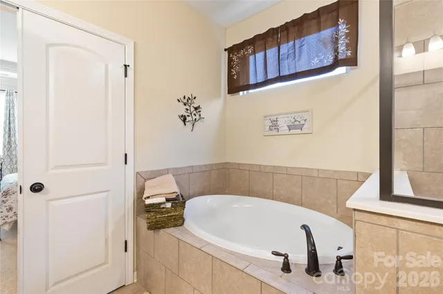 a bathroom with a tub and shower