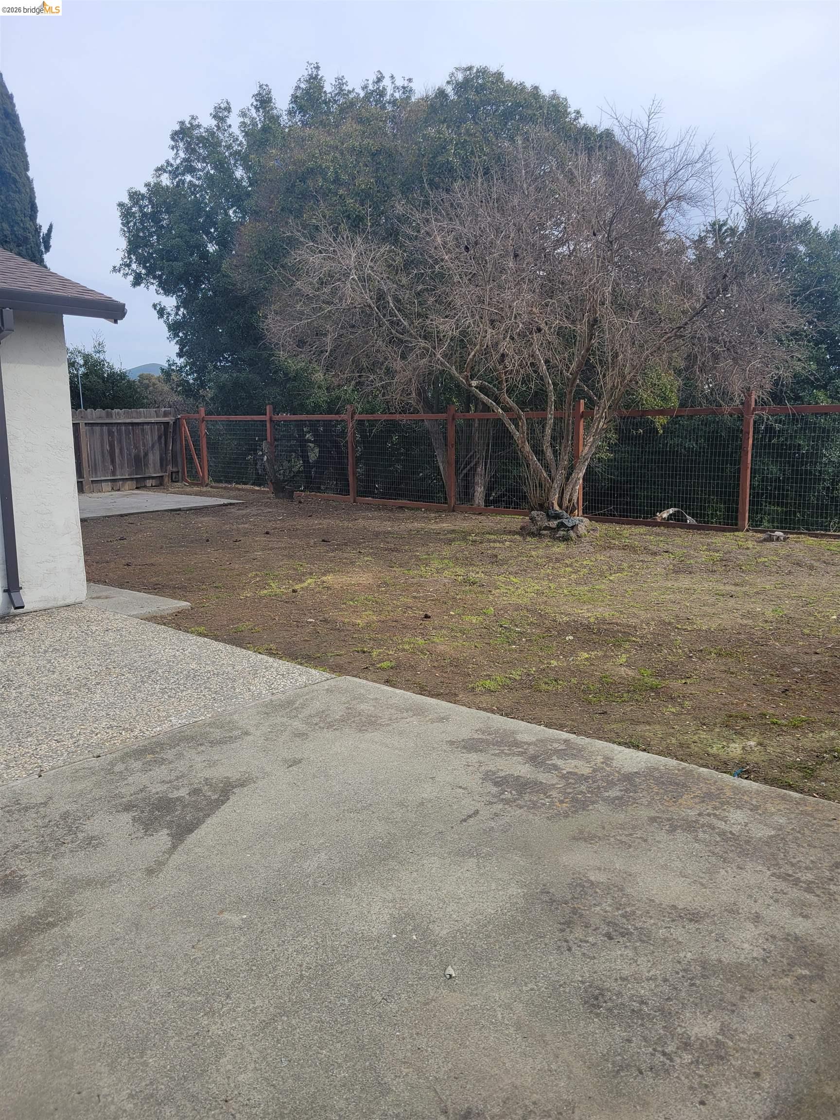 906 Coral Drive Rodeo, CA 94572 - Photo 15 of 21 a view of a yard with a trampoline
