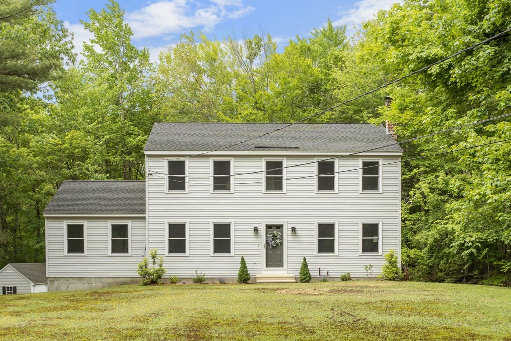 64 Wilder Road Ashby, MA 01431 - Photo 1 of 42 a front view of a house with a yard