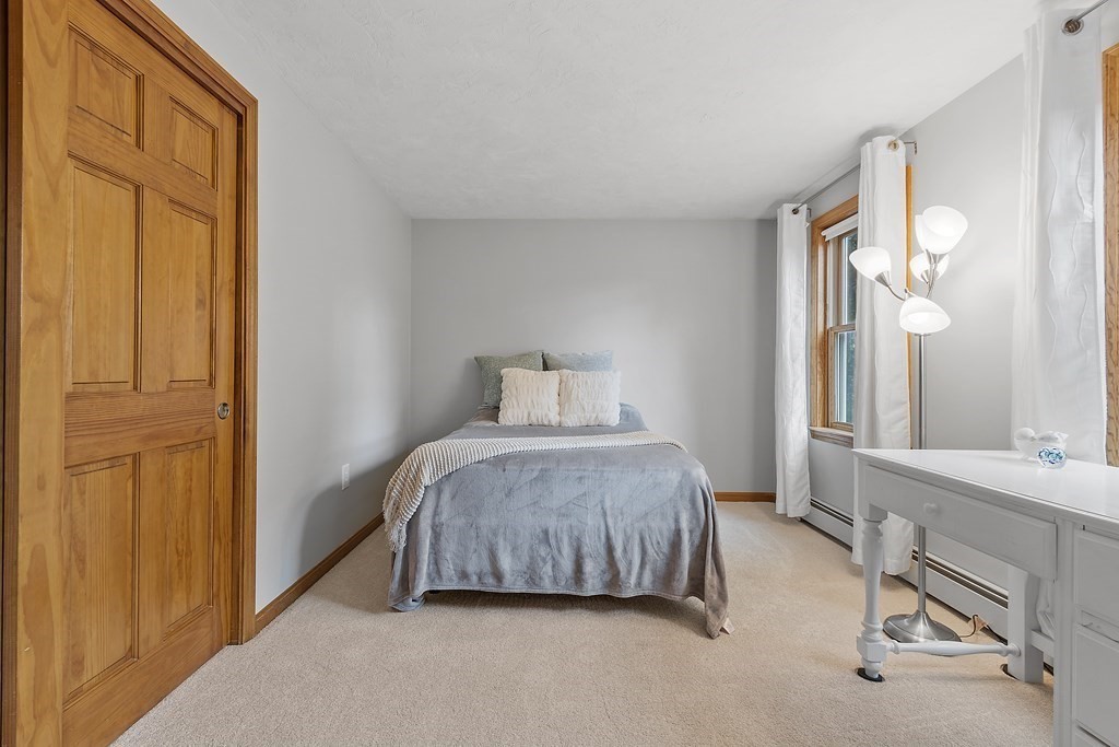 64 Wilder Road Ashby, MA 01431 - Photo 12 of 42 a bedroom with a bed and a table