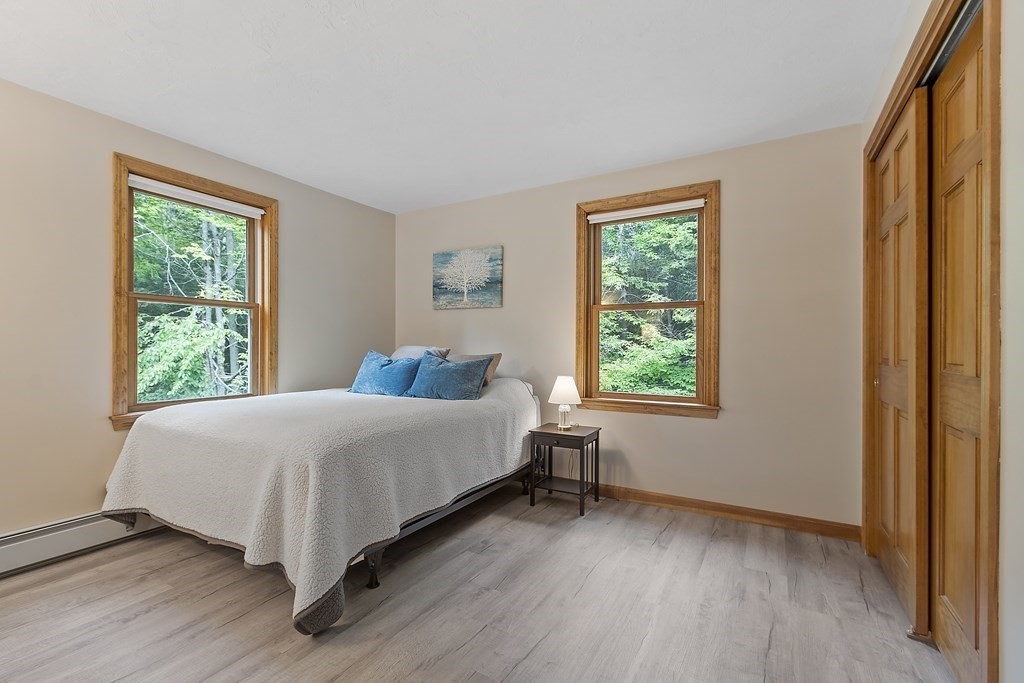 64 Wilder Road Ashby, MA 01431 - Photo 14 of 42 a bedroom with a bed and a window
