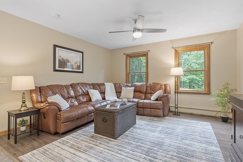 64 Wilder Road Ashby, MA 01431 - Photo 17 of 42 a living room with furniture and a large window
