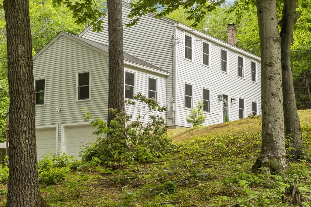 64 Wilder Road Ashby, MA 01431 - Photo 2 of 42 a front view of a house with garden