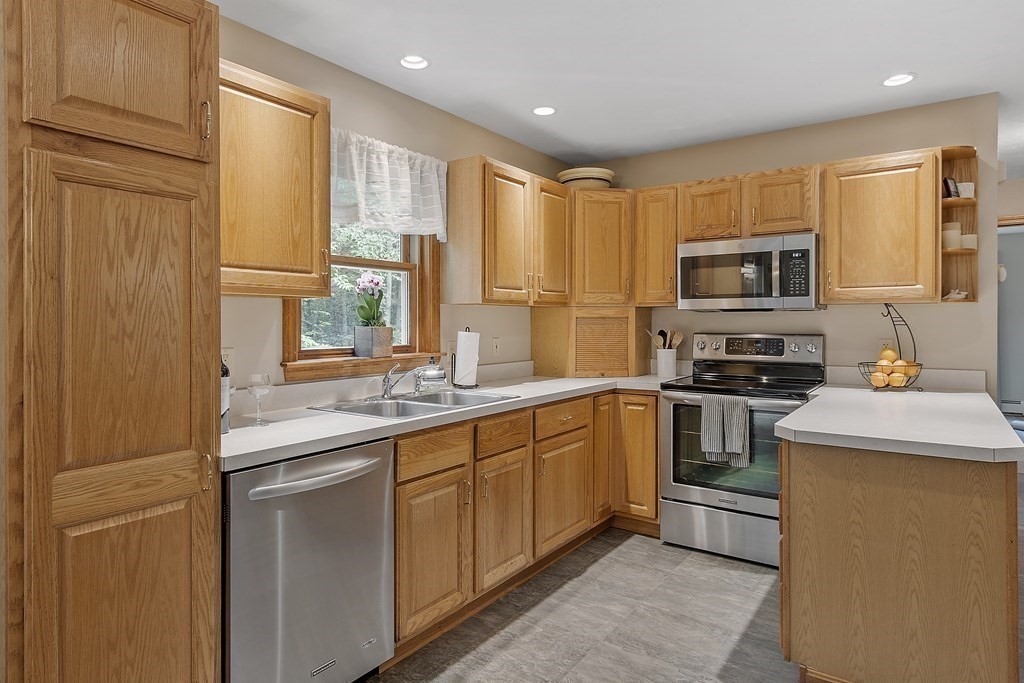 64 Wilder Road Ashby, MA 01431 - Photo 24 of 42 a kitchen with stainless steel appliances granite countertop a stove a sink and a refrigerator