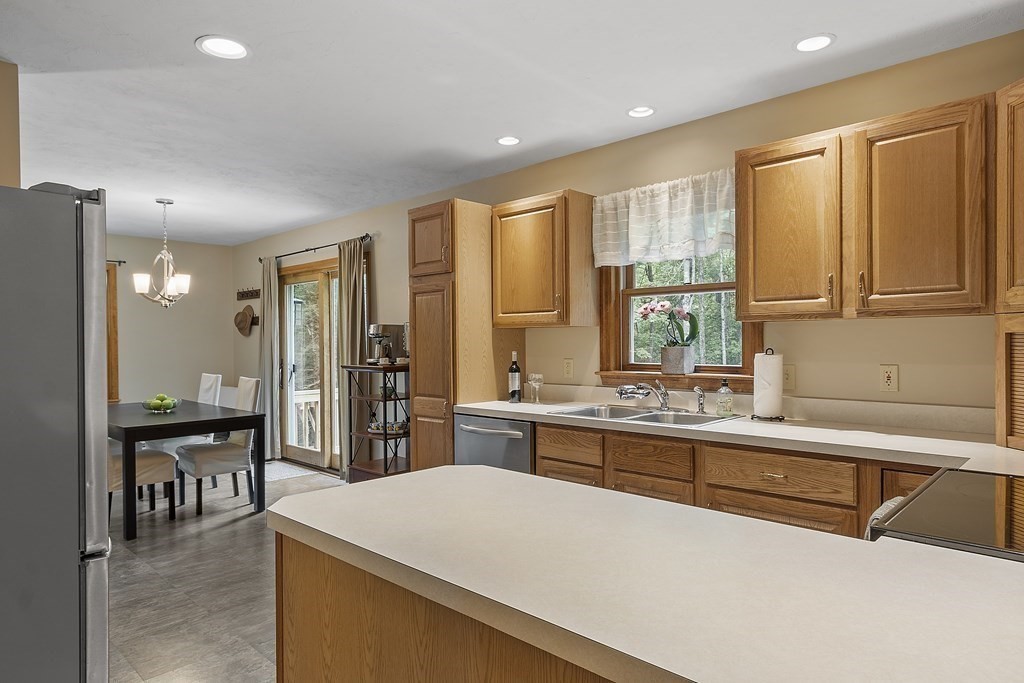 64 Wilder Road Ashby, MA 01431 - Photo 27 of 42 a large kitchen with kitchen island a sink a stove and a refrigerator
