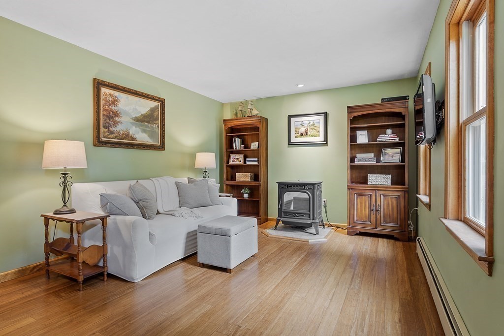64 Wilder Road Ashby, MA 01431 - Photo 34 of 42 a living room with furniture and a wooden floor