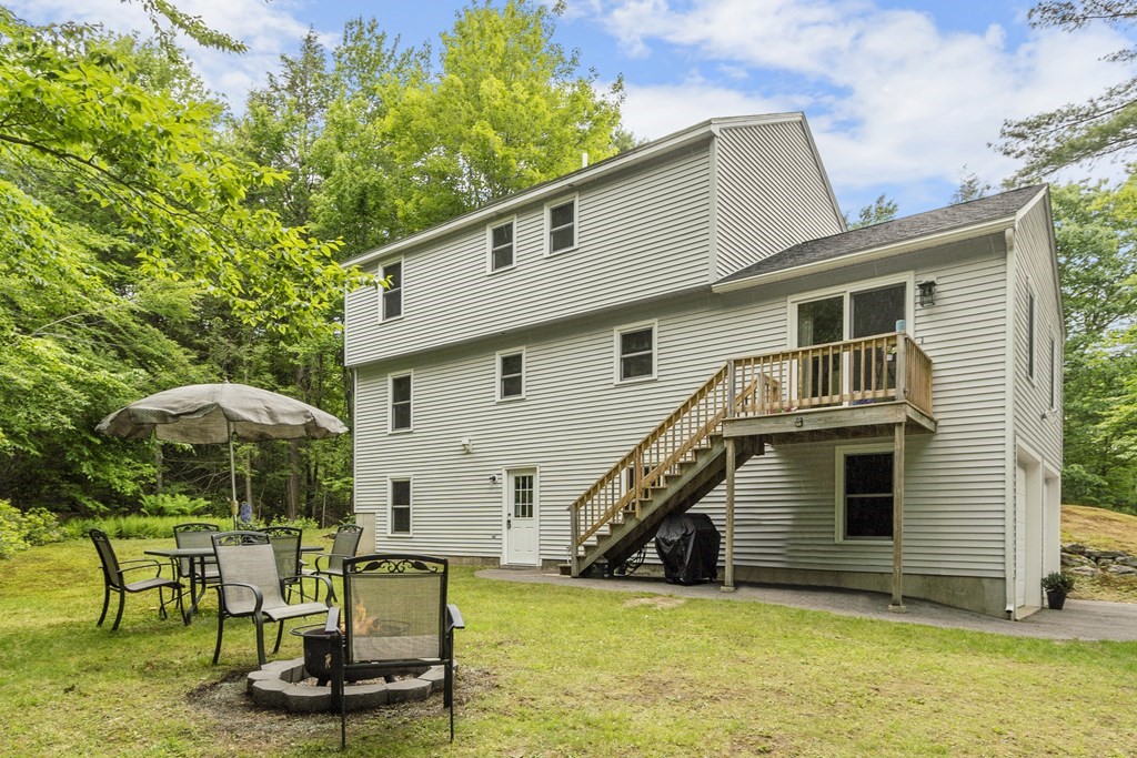 64 Wilder Road Ashby, MA 01431 - Photo 4 of 42 a view of a house with backyard porch and sitting area