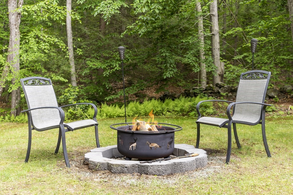 64 Wilder Road Ashby, MA 01431 - Photo 5 of 42 a view of a chairs and bench in the terrace
