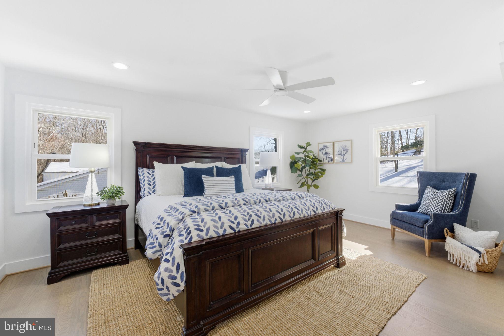 8615 Kerry Lane Springfield, VA 22152 - Photo 11 of 50 a bedroom with a large bed and a chair