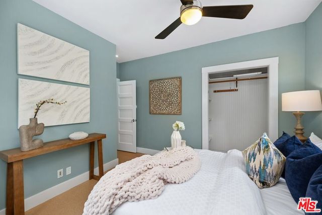 a bedroom with a bed and a table in it