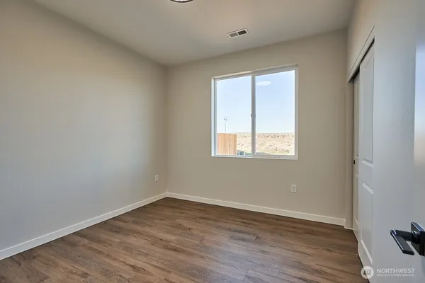 a view of an empty walk in closet