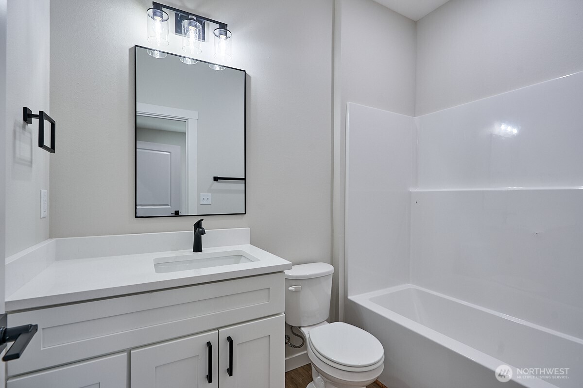 443 Partello Park Grand Coulee, WA 99133 - Photo 29 of 30 a bathroom with a sink a toilet and shower