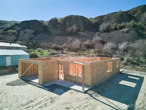a view of a backyard with sitting area