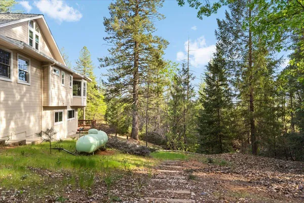 a backyard of a house with lots of green space
