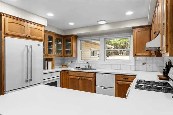a view of kitchen with furniture and wooden floor