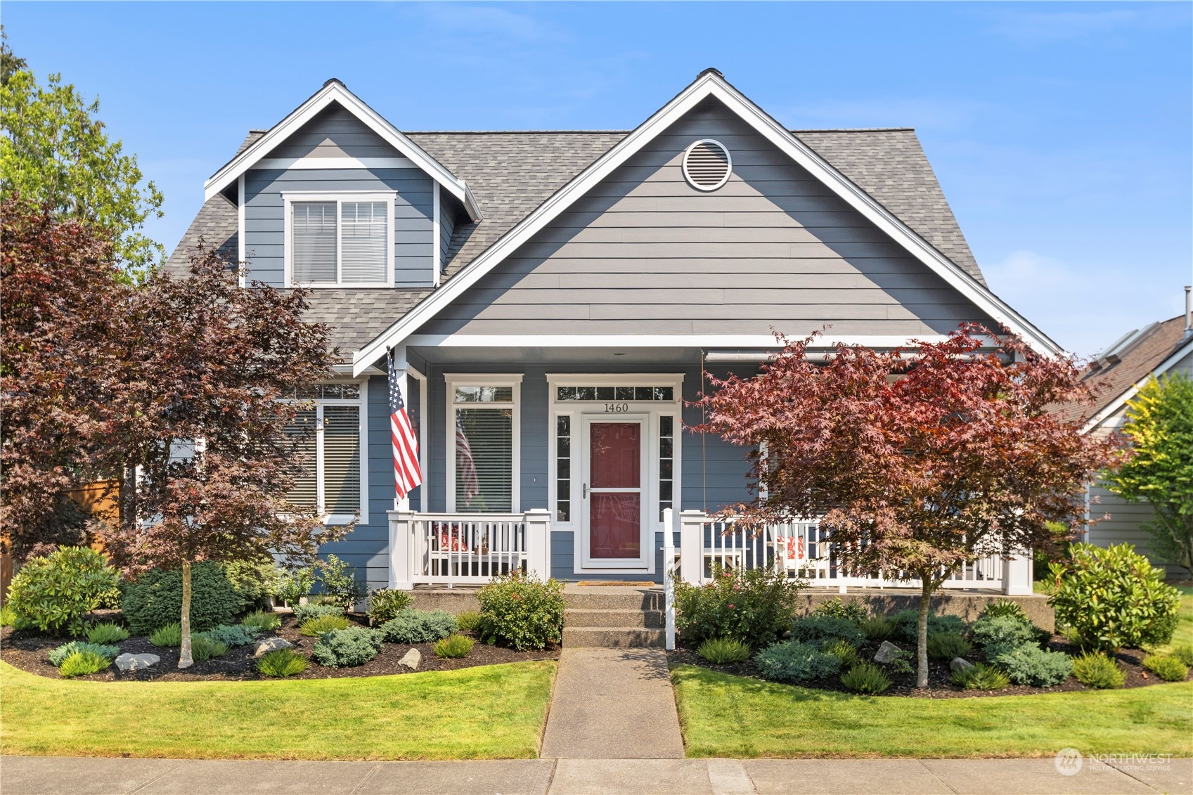 1460 Latham Court DuPont, WA 98327 - Photo 1 of 40 a front view of a house with garden