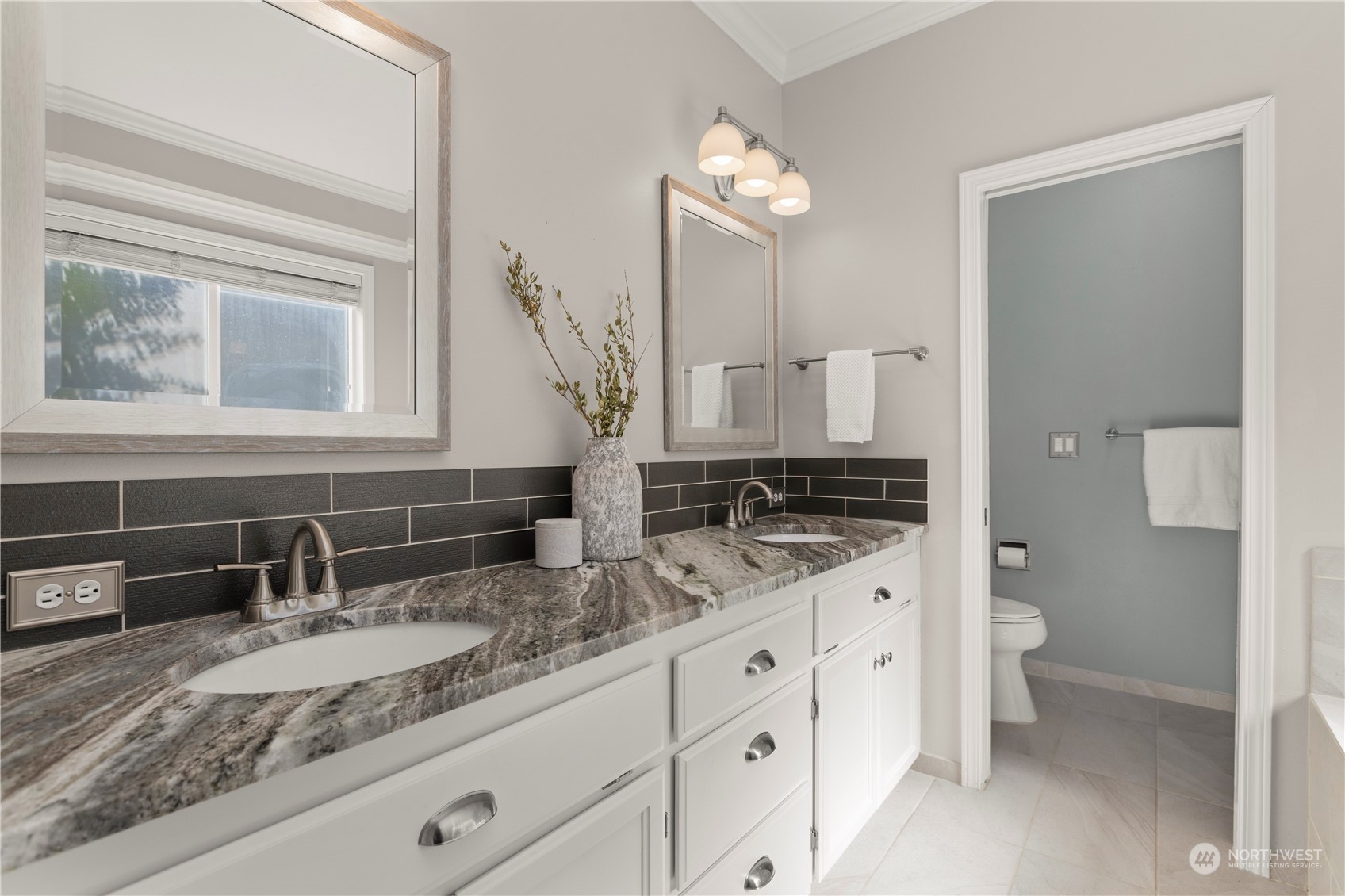 1460 Latham Court DuPont, WA 98327 - Photo 13 of 40 a bathroom with a granite countertop sink mirror vanity and toilet