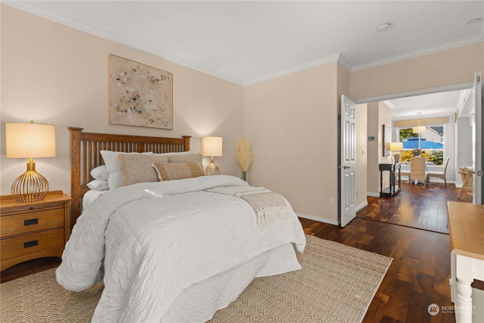 1460 Latham Court DuPont, WA 98327 - Photo 15 of 40 a spacious bedroom with a bed and a lamp on table