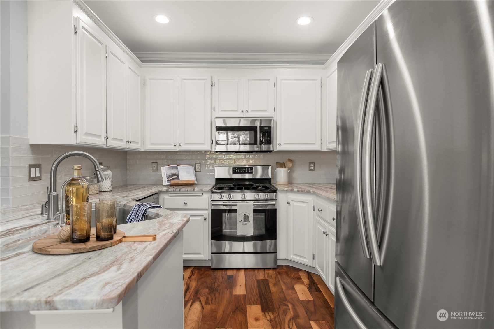 1460 Latham Court DuPont, WA 98327 - Photo 20 of 40 a kitchen with stainless steel appliances granite countertop a refrigerator and a stove