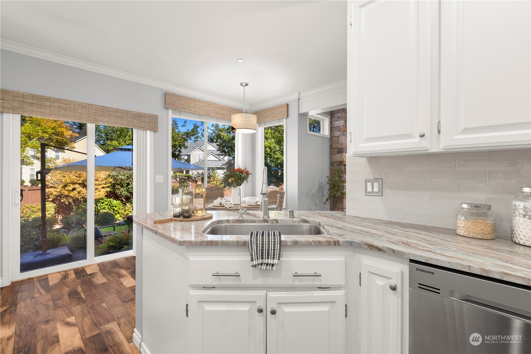 1460 Latham Court DuPont, WA 98327 - Photo 21 of 40 a kitchen with stainless steel appliances granite countertop a sink and cabinets