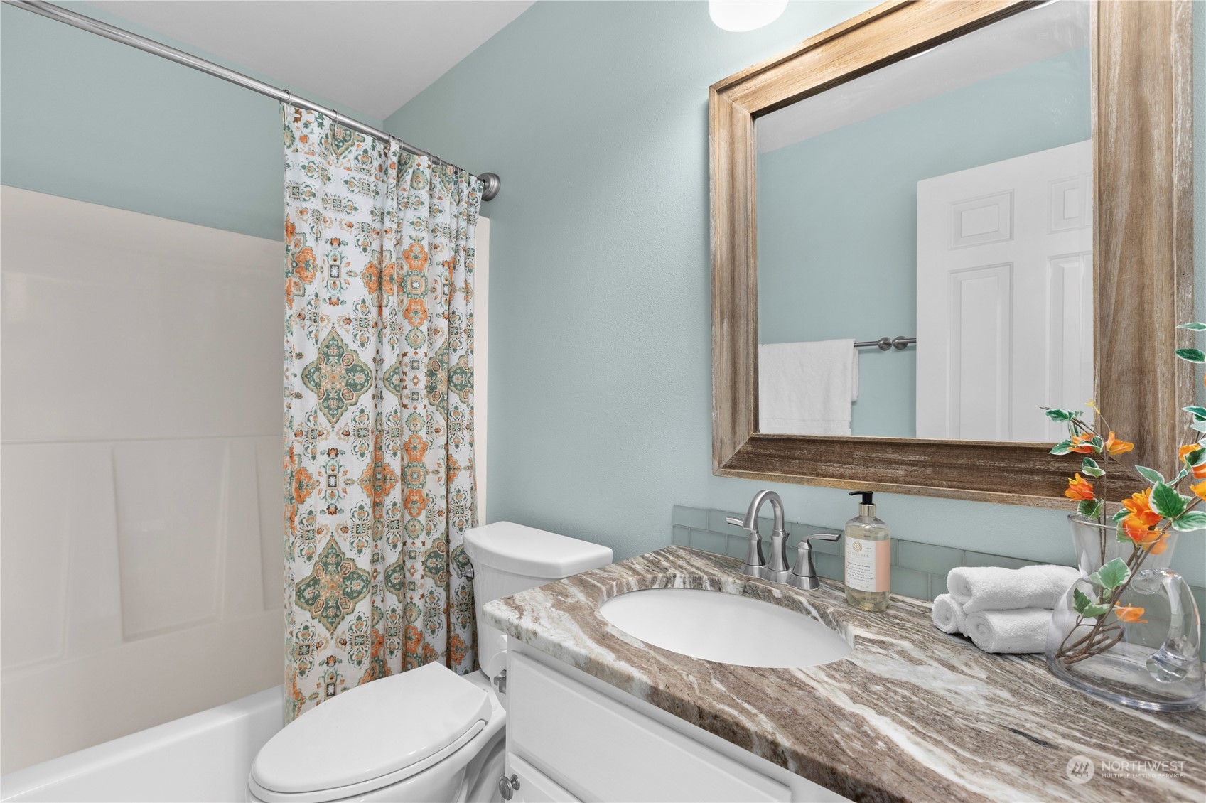 1460 Latham Court DuPont, WA 98327 - Photo 24 of 40 a bathroom with a granite countertop sink toilet and mirror