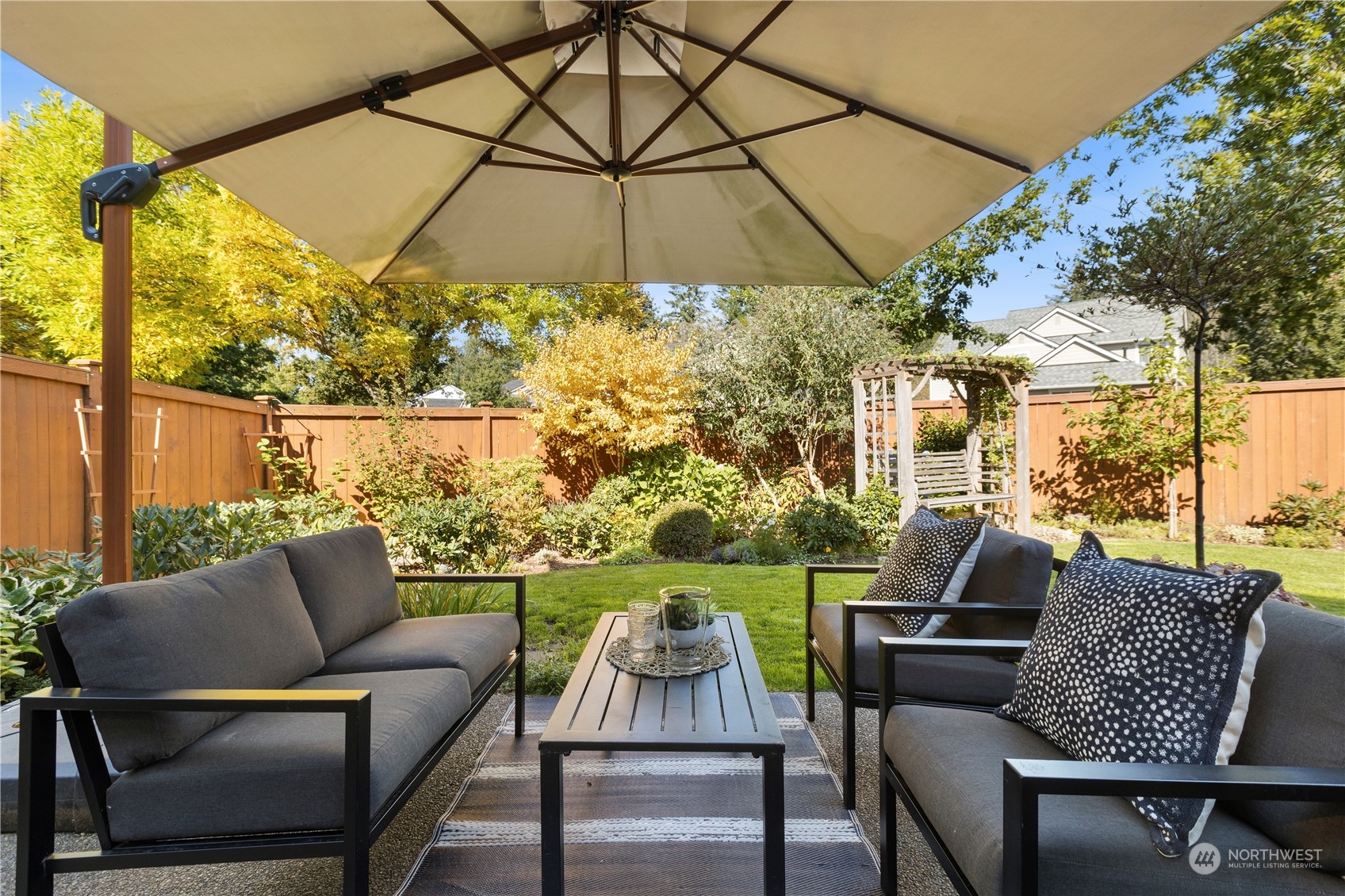 1460 Latham Court DuPont, WA 98327 - Photo 28 of 40 a outdoor living space with furniture and umbrella