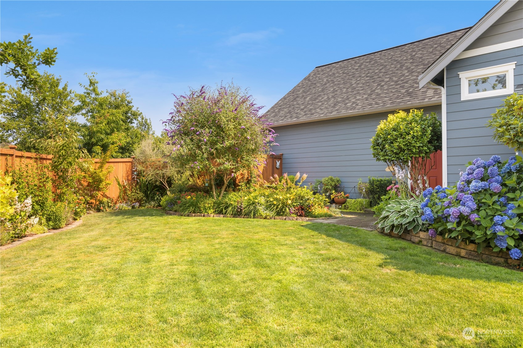 1460 Latham Court DuPont, WA 98327 - Photo 29 of 40 a view of yellow house with a yard