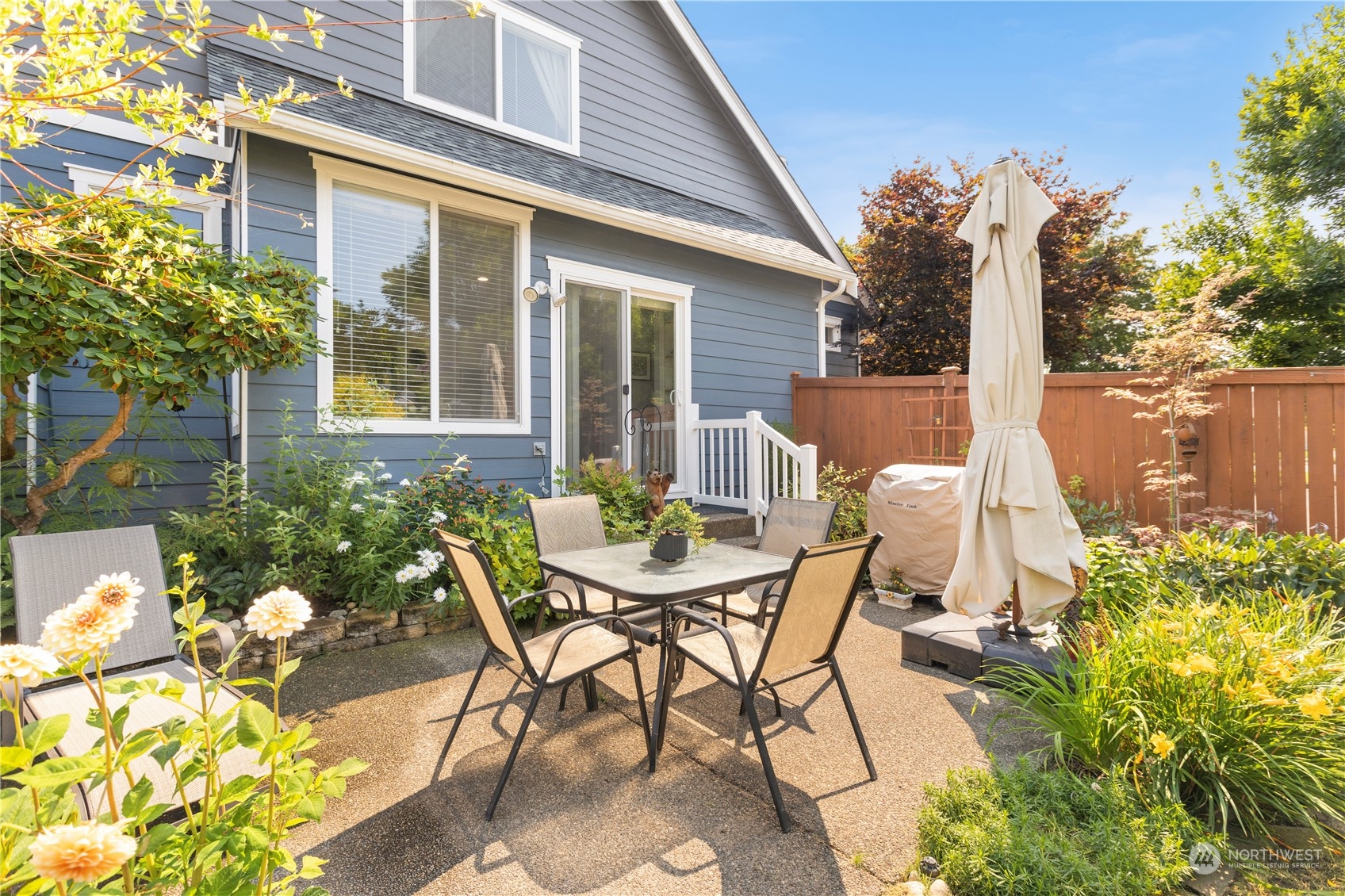 1460 Latham Court DuPont, WA 98327 - Photo 32 of 40 a view of a patio with table and chairs and potted plants