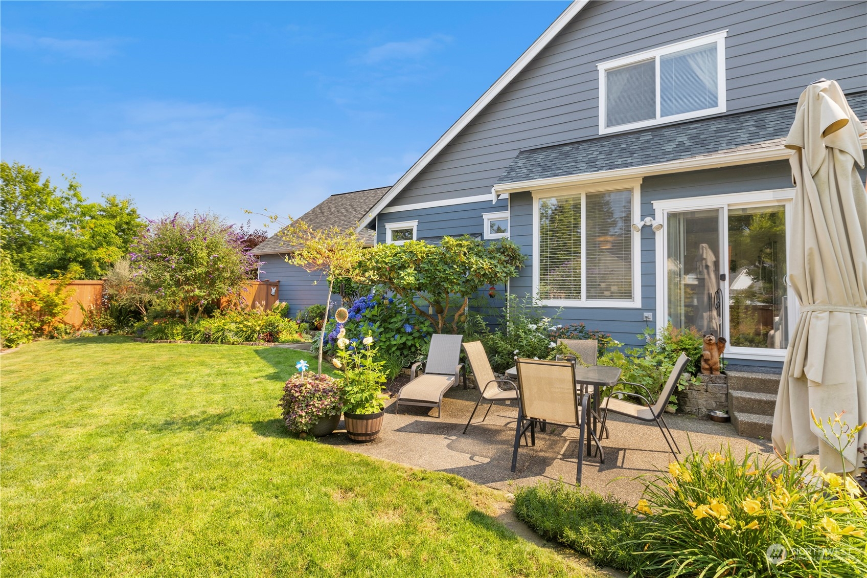 1460 Latham Court DuPont, WA 98327 - Photo 34 of 40 a view of a patio with table and chairs and potted plants