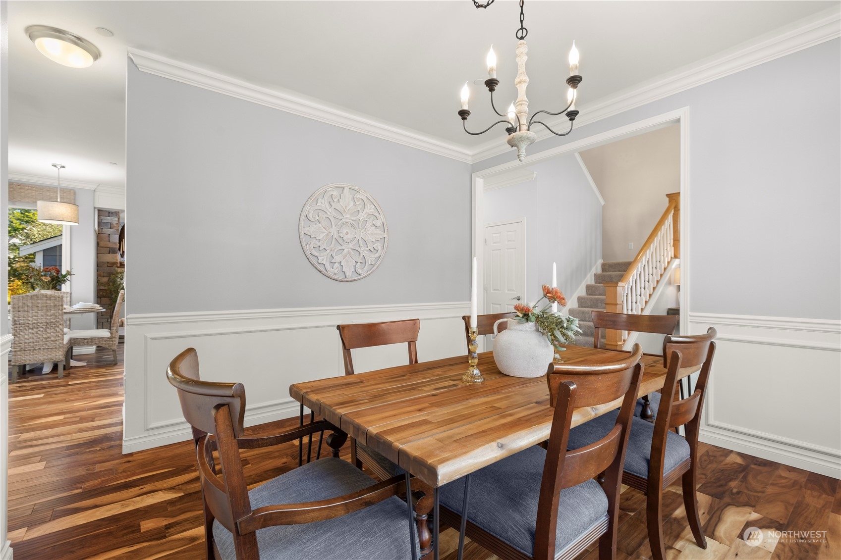 1460 Latham Court DuPont, WA 98327 - Photo 7 of 40 a dining room with furniture a chandelier and wooden floor