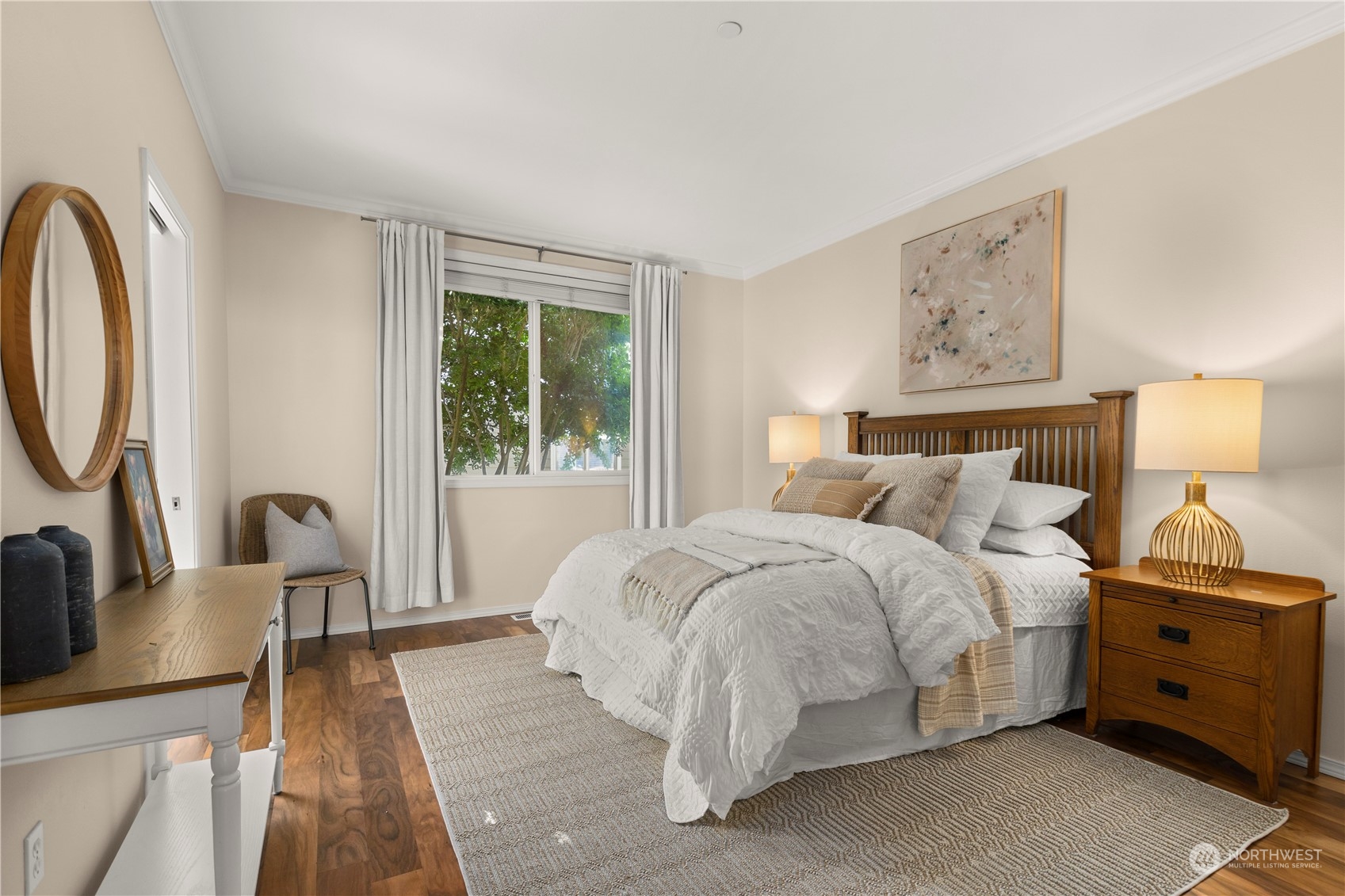 1460 Latham Court DuPont, WA 98327 - Photo 9 of 40 a spacious bedroom with a bed a couch and a window