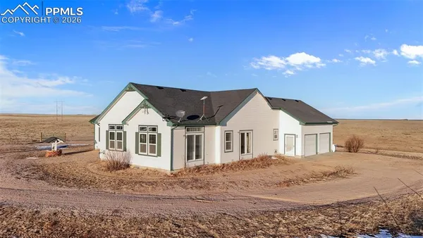 a view of a house with a big yard