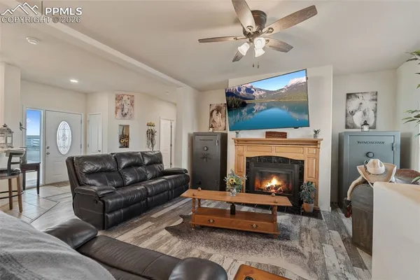 a living room with furniture and a fireplace