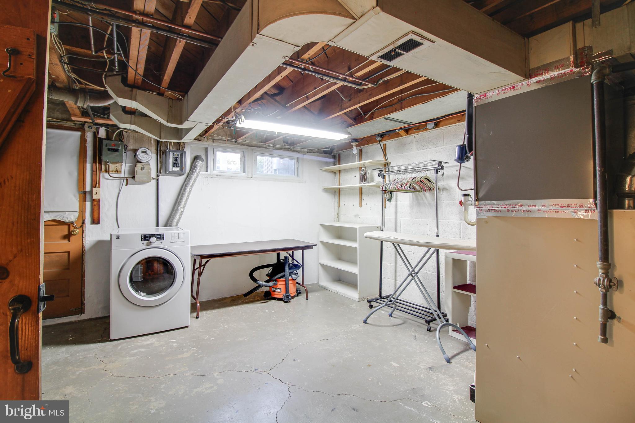 5638 Braxfield Road Halethorpe, MD 21227 - Photo 23 of 29 Walk out basement. Shelving comes with the house.