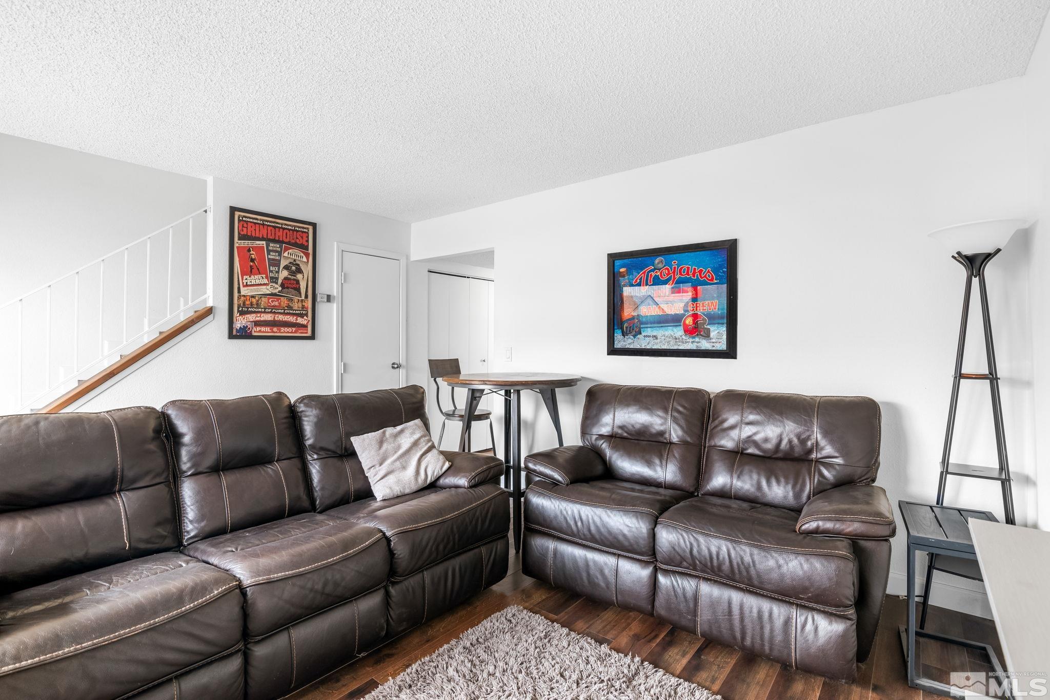13968 Lear Boulevard Reno, NV 89506 - Photo 14 of 39 a blue couch sitting next to a blue wall