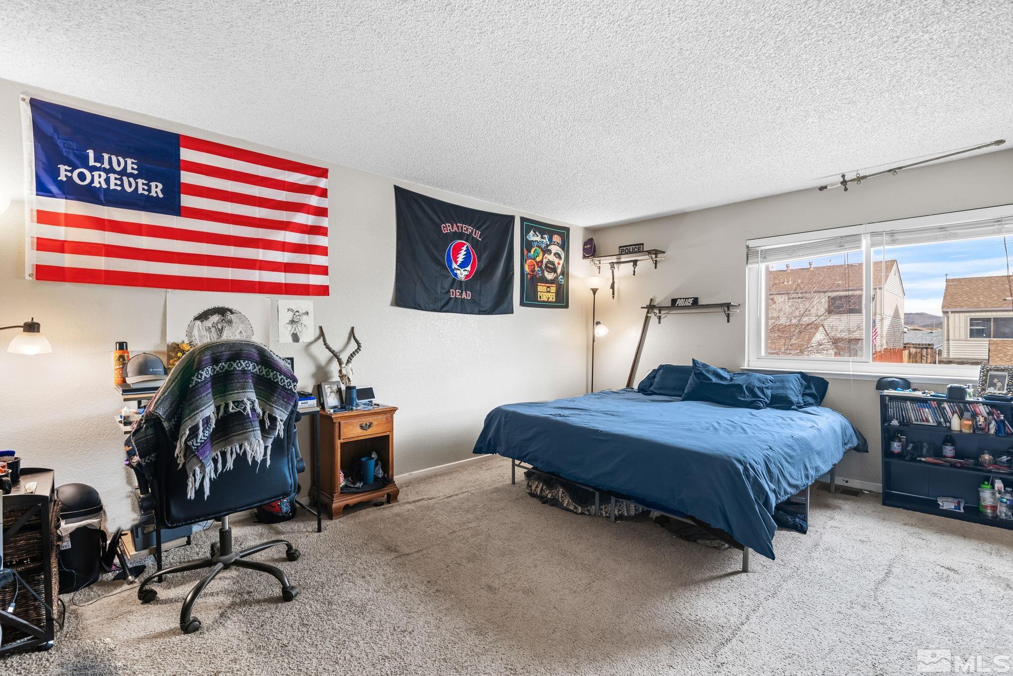13968 Lear Boulevard Reno, NV 89506 - Photo 18 of 39 a bedroom with furniture and a bed