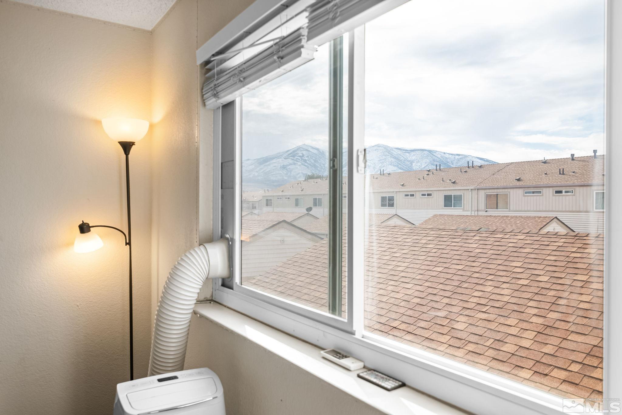 13968 Lear Boulevard Reno, NV 89506 - Photo 24 of 39 a view of a balcony with chair and front door