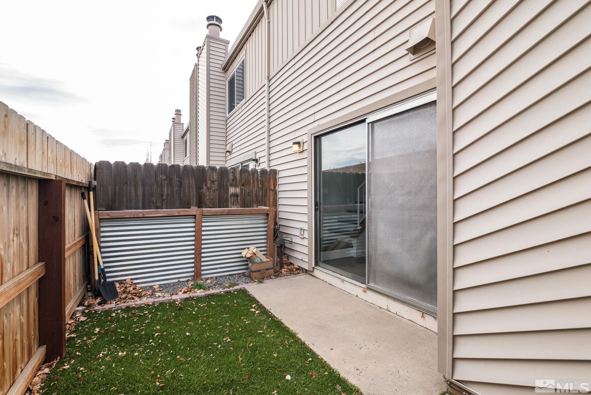 13968 Lear Boulevard Reno, NV 89506 - Photo 25 of 39 a view of a house with backyard and wooden fence