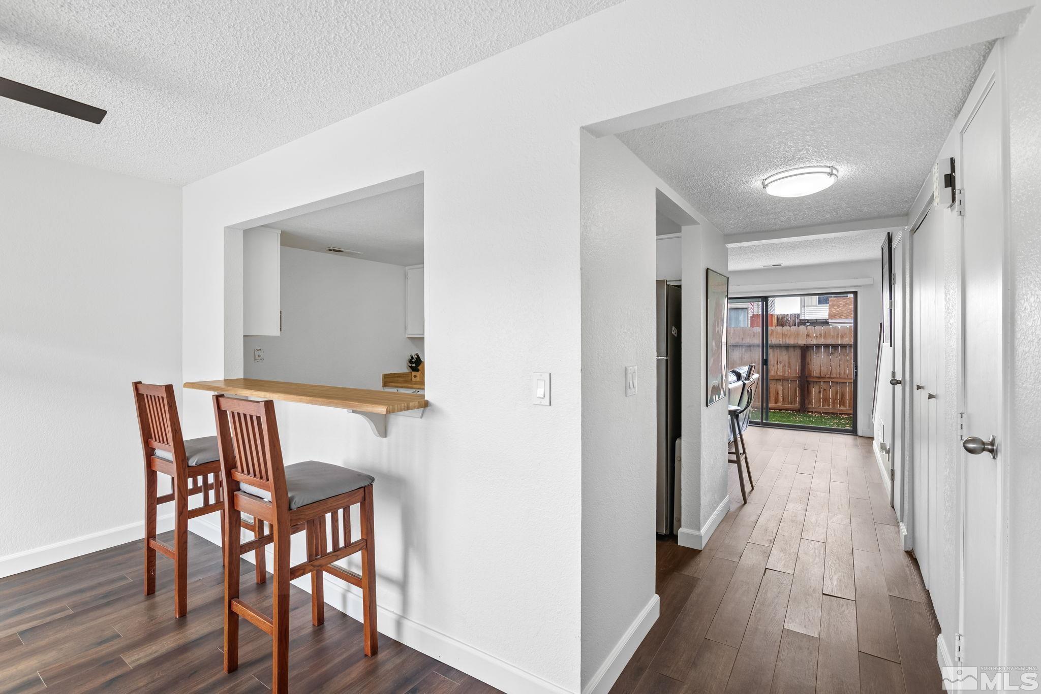13968 Lear Boulevard Reno, NV 89506 - Photo 3 of 39 a view of a hallway and wooden floor a bathroom
