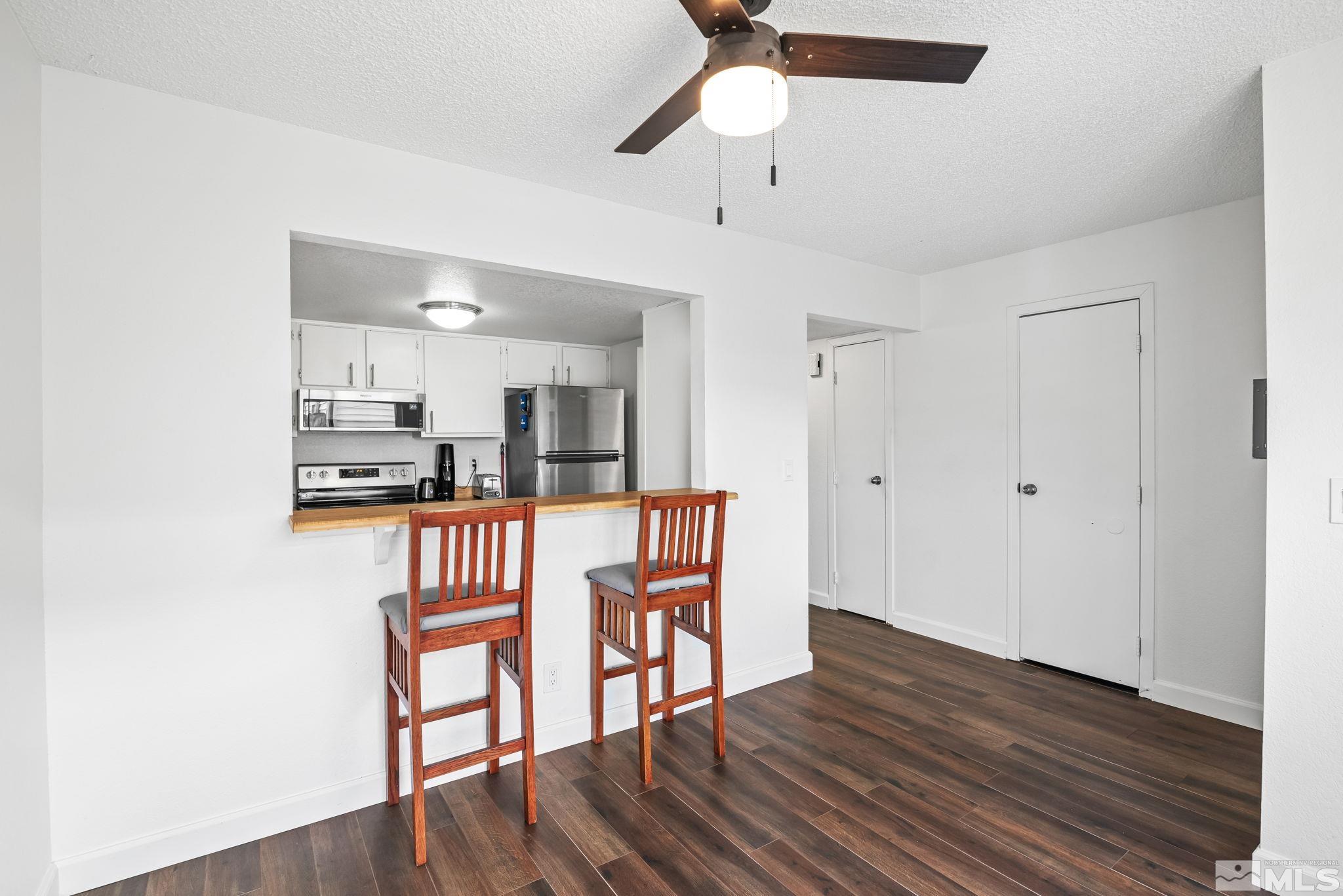 13968 Lear Boulevard Reno, NV 89506 - Photo 5 of 39 a view of a kitchen from the hallway