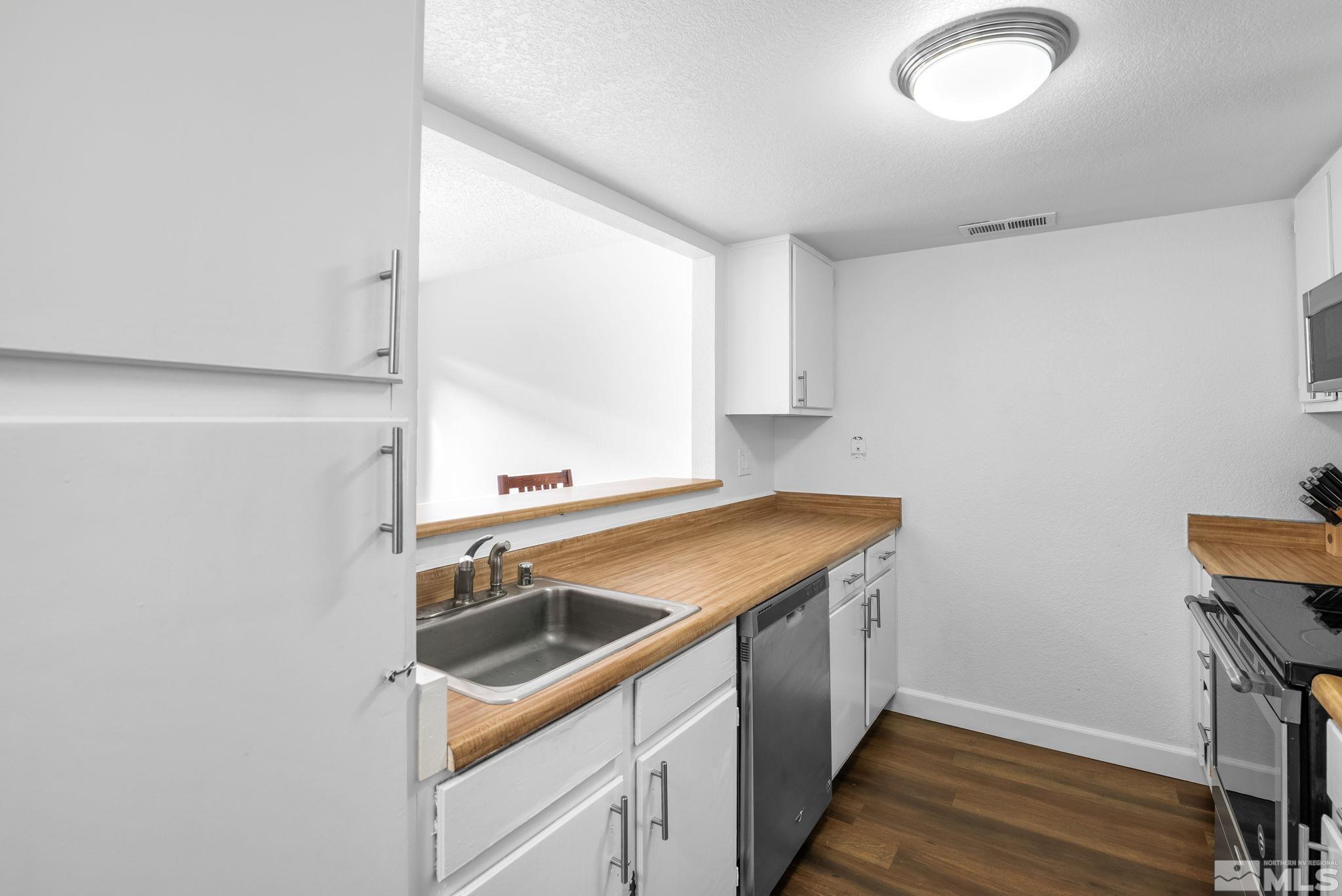 13968 Lear Boulevard Reno, NV 89506 - Photo 8 of 39 a bathroom with a sink and a window